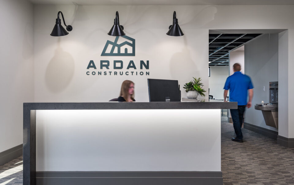 ArDan Construction office reception desk wall logo entryway